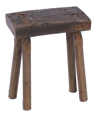 A 19thC rustic oak stool, 37cm wide.