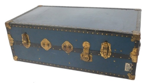 A mid century Victor Wardrobe blue luggage trunk, with brass