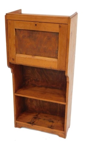 A pine student's bureau, with a galleried top over a fall, enclosing three recesses, above two shelves, raised on bracket feet, 91cm high, 42cm wide, 24cm deep.