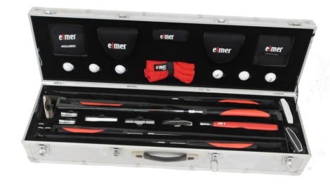 An Elmer golf set, comprising golf clubs and irons, balls, tees, and accessories, metal cased, case 103cm wide.