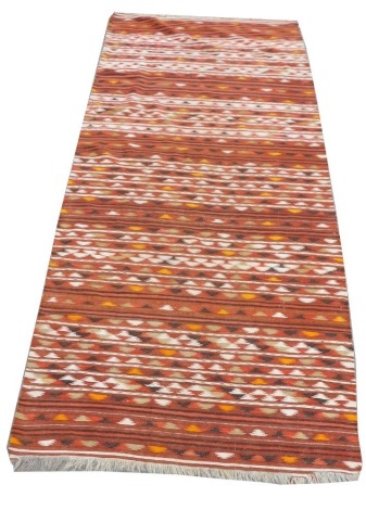 An Afghan Kilim red ground runner, decorated with bands of geometric or foliate motifs, 271cm x 120cm.