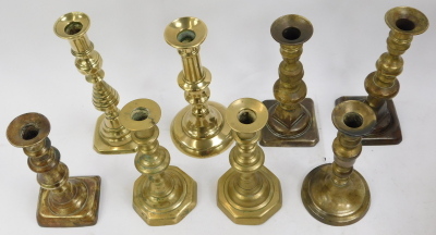 A selection of brass candlesticks, mainly singles but one pair. (a quantity) - 2