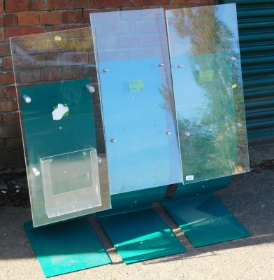 Three Perspex display stands.