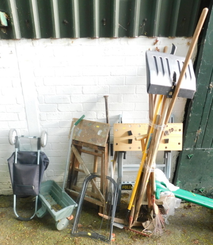 A fold away work bench, various garden tools, step ladder, spreader, etc. (a quantity)