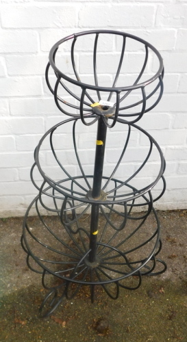 A three tier metal plant stand.