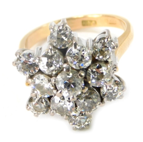 An 18ct gold diamond cluster ring, with star arrangement, each stone rose cut, the central stone approx 0.31ct, surrounded by six further stones of similar size and six point outer border, total estimate carat weight 4.03ct, ring size N, 10.6g all in, box