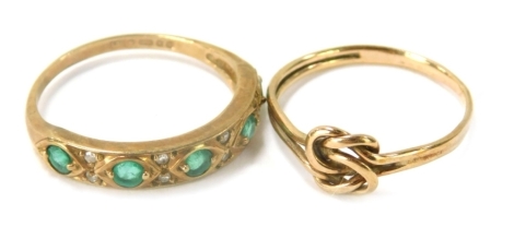 Two dress rings, comprising a 9ct gold dress ring set with emeralds and diamonds, of half hoop design, ring size K½, and a 9ct gold knotted dress ring, ring size I, 2.5g all in. (2)