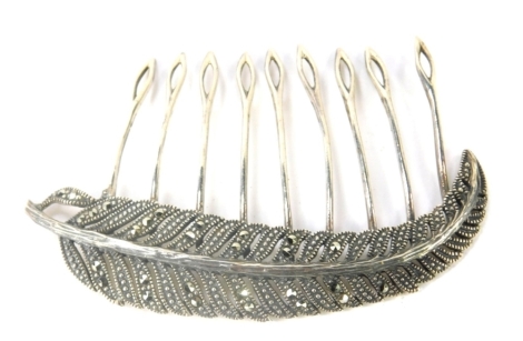 A marcasite fern hair clip, the shaped fern set with marcasite with nine slides, white metal stamped 925, 13.3g all in.