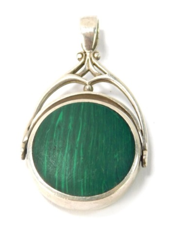 A silver and malachite swivel pendant, the central circular swivel pendant double sided with malachite and black onyx, in a silver shaped frame, 5cm high, 17.4g all in.