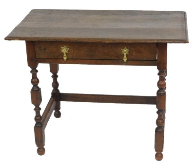 An 18thC oak side table, with moulded top, frieze drawer, and baluster turned legs, 73cm high, 97cm wide.