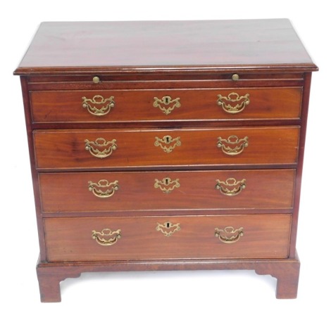 A George III mahogany bachelor's chest, with brushing slide over for graduated drawers with brass pierced backplate handles and bracket feet, 82cm high, 85cm wide, 47cm deep.