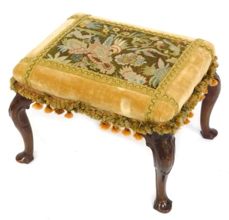 A Victorian walnut stool, with Neoclassical carved cabriole legs, upholstered in wool work and crushed velvet, 60cm x 47cm.