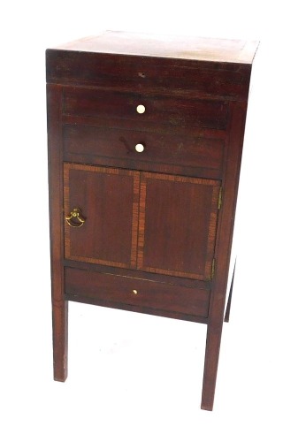 A George III mahogany night table, with lift top, drawers, and cupboards, 71cm high.