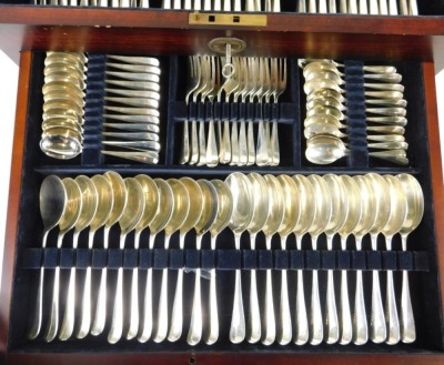 A comprehensive Elizabeth II canteen of silver cutlery, by Carrs for Harrods, Rat tail pattern in Holbrook canteen, with settings for twelve to include fish eaters, knives, forks, sharpening set, dessert spoons, teaspoons and other serving pieces, 176.48o - 2