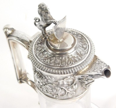 A matched pair of Edwardian silver, silver plated and cut glass claret jugs, by Elkington and Co, each with a lion and shield finial, angular thumb mould handle, and repousse decorated tops decorated with vine leaves and grapes with shaped spouts and bell - 2