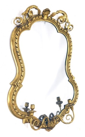 A 19thC gilt gesso girandole wall mirror, the shield shaped plate surrounded by a foliate beaded and ribbon decorated frame, the base applied with two candle arms, 102cm high, 68cm wide.