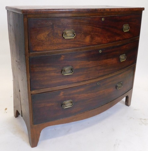 An early 19thC mahogany bowfront chest, of three drawers, with bracket feet, 103cm wide. (AF)