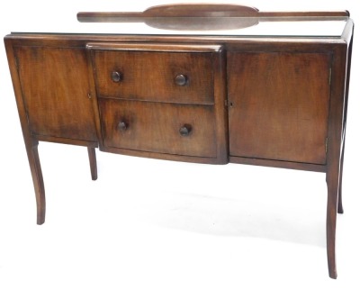 A 1950's sideboard, with two central drawers, on splayed legs.