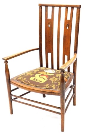 An Arts and Crafts Denby and Spinks of Leeds dining chair, with compressed comb top above inlaid H shaped splats, shaped arms on turned supports, terminating in turned stiles, joined by turned front stretchers, 84cm high.