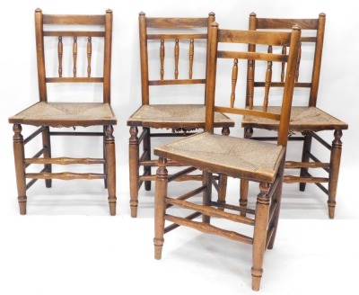 An 18thC oak drop leaf dining table, on heavy turned legs, with gate leg action and block supports, when closed 80cm high, 102cm wide, 52cm deep, and a set of four Lancashire style spindle back dining chairs, with rush style seats. (5) - 2