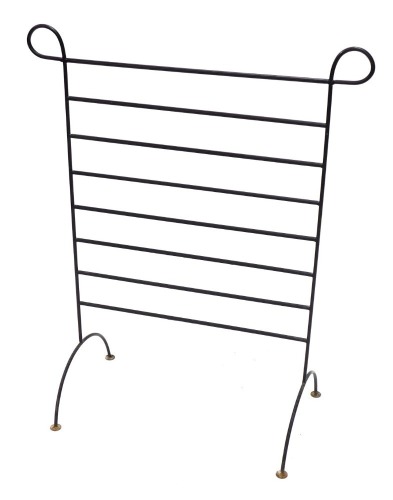 A wrought iron towel rail, on circular feet, 93cm high.