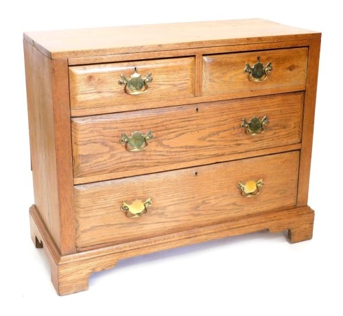 A George III style oak chest,of two short and two long drawers, on ogee bracket feet, 82cm high, 97cm wide, 42cm deep.