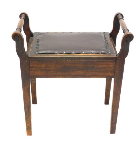 An Edwardian piano stool, with studded leather lift up seat and scroll arms, on square tapering legs, 57cm high, 58cm wide, 37cm deep.