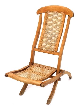 An early 20thC beech folding chair, with bergere back and seat, 82cm high.