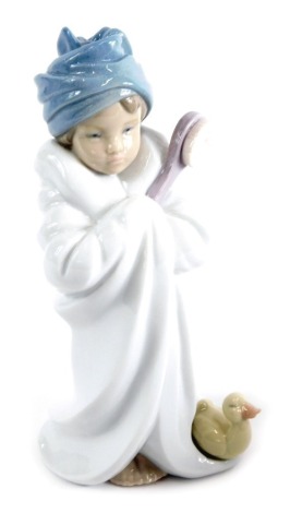 A Lladro figure, La Hora del Bueno, number 06800, printed marks beneath, 21cm high, boxed.