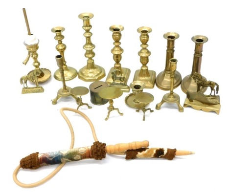 Various brassware, to include a quantity of candlesticks, a matched pair with oval bases, 21cm high, etc., various other candlesticks, goat ornament, miniature tripod table. (a quantity)