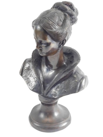 A 20thC bronze bust of a lady, in flowing robes her hair up, on a socle, unmarked, 39cm high.