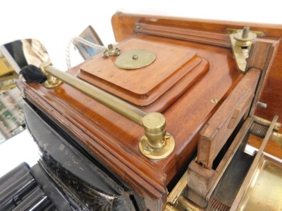 A late Victorian brass, mahogany and toleware magic lantern, stamped D. Noakes and Sons, Greenwich, London, on a rectangular base and various slides, including a man riding a pig. - 3