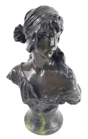 An Art Nouveau bronze bust of a lady, in flowing robes wearing headdress, on a marble finish socle, 39cm high.