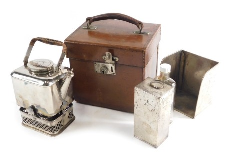 An early 20thC chrome plated travelling kettle set, with spirit burner, in pressed leather case with bamboo finish handles, 25cm high.