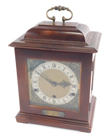 A 20thC caddy top chiming mantel clock, with Arabic and Roman numeric chapter ring and raised spandrels, in a plain case, on squat bracket feet, with chiming eight day movement, 31cm high.