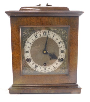 A 20thC Elliot style caddy top mantel clock, with 13cm diameter Arabic and Roman numeric dials, with raised metal spandrels, in shaped case, with Westminster chiming action striking on the hour, with pendulum, 32cm high.