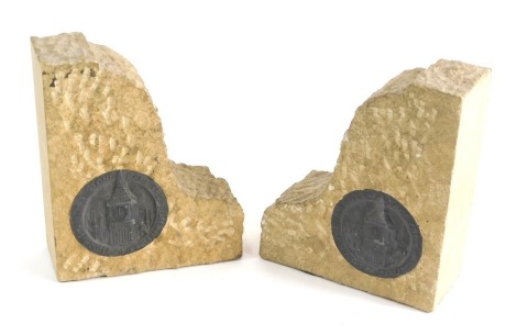 A pair of stone bookends, each with plaques marked This Stone Came from The Houses of Parliament, 16cm high.