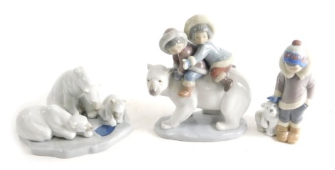 Three Lladro figures, Bearly Love, 01443, 8cm high, and another children on polar bear, etc., printed marks beneath. (3, with 1 box)