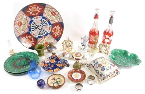 Various pottery and effects, butter dish, pair of Bohemian flash glass red, clear and frosted glass decanters, 33cm high, leaf plates, modern Imari wall plate, various vases, Continental porcelain figure groups, character jugs, transfer printed ware, etc.