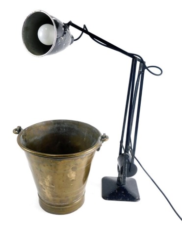 A 20thC metal Anglepoise lamp, with black metal articulated stem, on shaped base, and a brass bucket with swing handle, 32cm high. (2)