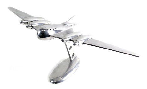 A mid 20thC Art Deco chrome plated desk aeroplane, on oval base, 29cm high.