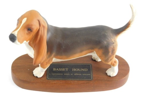 A Beswick Connoisseur model of a basset hound, matt finish, on wooden plinth base, marked to the base and to the underside, 15cm high.