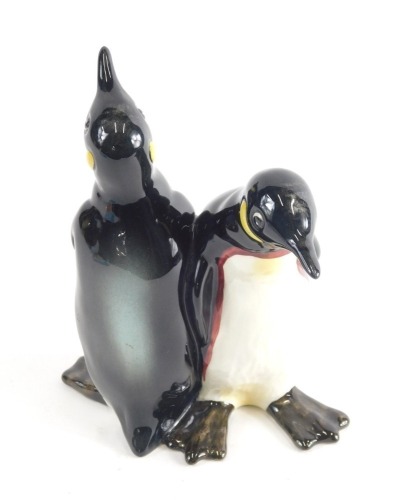 A Beswick pottery figure group of a penguins, number 1015, printed and impressed marks beneath, 14cm high.