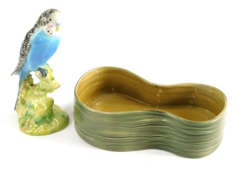 A Beswick pottery figure of a budgie, number 1217, impressed marks beneath, and a shaped vase or stand, number 2068. (2)