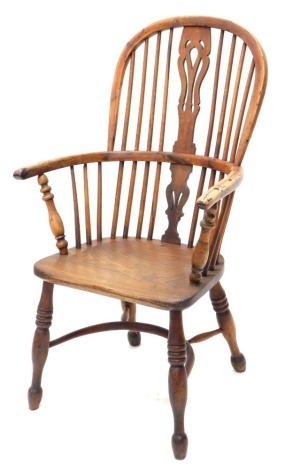 A 19thC yew and elm high back Windsor chair, with pierced splat, triple ring turned front legs and a crinoline stretcher, unmarked, 102cm high.