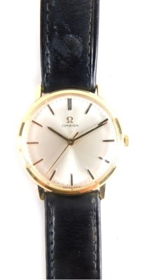 An Omega wristwatch, with silver coloured dial and plain baton dial marked Swiss Made, the reverse un-engraved with black leather strap and Omega buckle, 22cm long overall, the dial 3.2cm diameter.