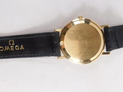 An Omega wristwatch, with silver coloured dial and plain baton dial marked Swiss Made, the reverse un-engraved with black leather strap and Omega buckle, 22cm long overall, the dial 3.2cm diameter. - 3