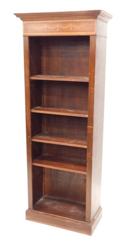 An Edwardian style mahogany open bookcase, with dentil frieze above a stencilled garland, and adjustable shelves beneath, on a block base, 176cm high, 72 wide, 55cm deep.