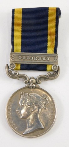 A medal, marked Army Of The Punjab, the ribbon with Goojerat clasp.