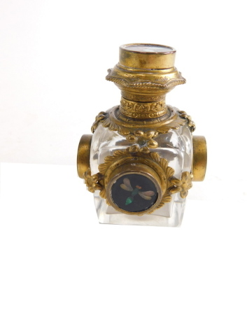 A 19thC Palais Royale gilt metal, glass and pietra dura perfume bottle, of shouldered form, with elaborate hinged lid revealing glass stopper, with floral embellishments and roundels set with insets, unmarked, 9cm high.